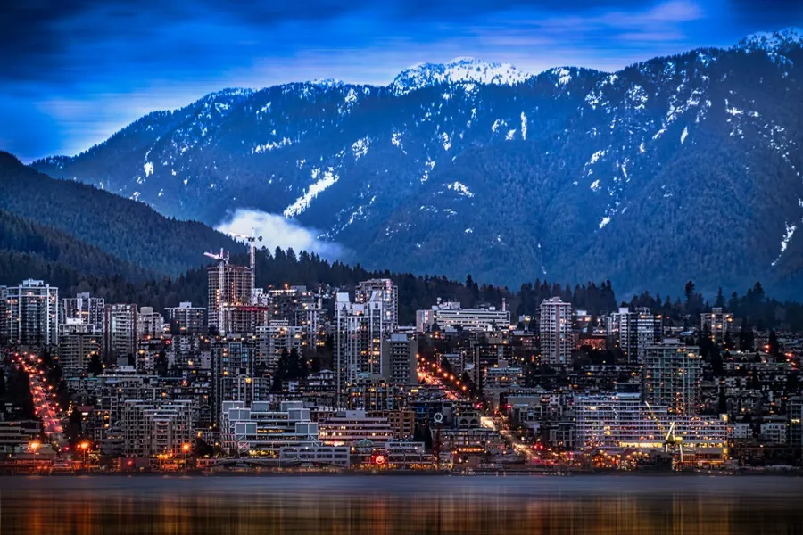 North Vancouver homes with trees and rain clouds